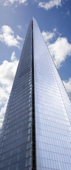 shard skyscraper looming high into the beautiful blue cloudy sky