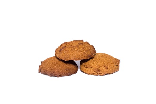 Three oatmeal cookies. Healthy diet isolated on white background.