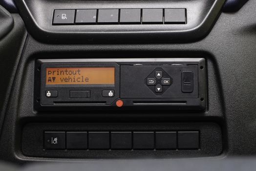 Digital tachograph display reads Printout Vehicle. No personal data. Tachograph in a van.