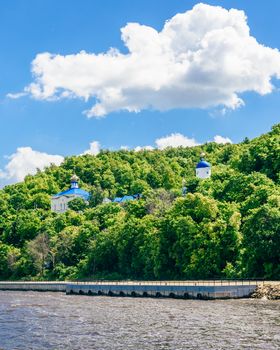 Beautiful and White Makary Monastery in Coastal Forest.