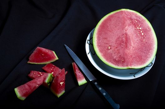 Watermelon chopped black background