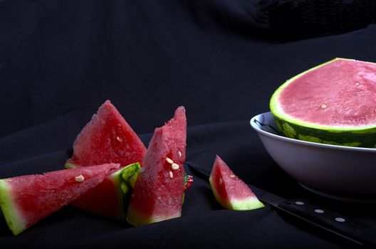 Watermelon chopped black background