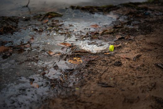 Plastic Scrap pollution in the water , environment protection concepts . Selective focus