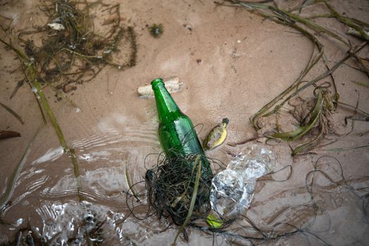 Bottle Scrap pollution in the water , environment protection concepts . Selective focus