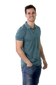 Handsome young man in green shirt and jeans posing isolated on white background in studio,