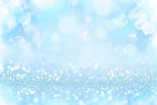 Christmas and New Year holidays blue background . Blurred glitter Bokeh