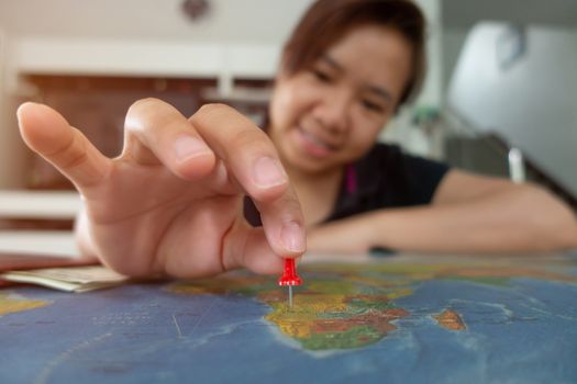 asian woman pinned on the map location