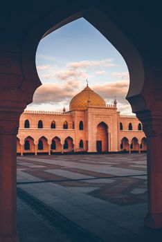Beautiful White Mosque in the Sunset Light. View through the Arch. Bolghar, Rusiia.