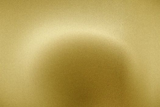 Light shining on brushed gold metal panel, abstract texture background
