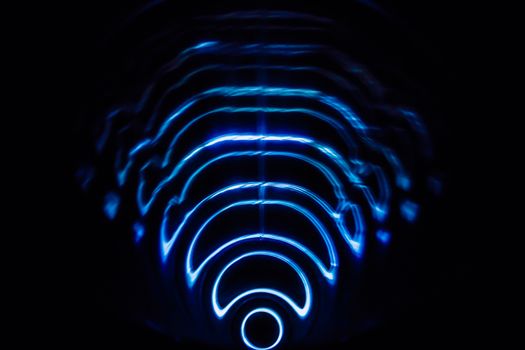 Sound waves in the visible blue color in the dark