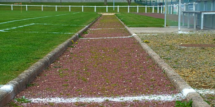Long jump path on a stadium, front view