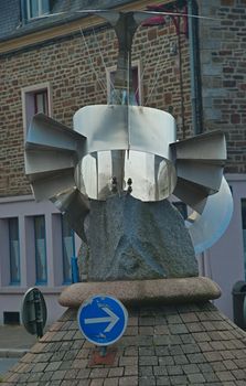 Strange abstract metal monument on round crossroad