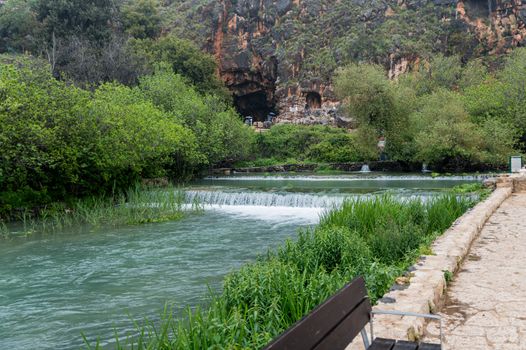 In the background of the Banias Spring is Pan's Cave, where the waterway originated in ancient times