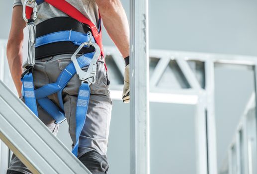 Construction Safety Harness Equipment. Industrial Security and Protection. Contractor at Height Closeup Photo.