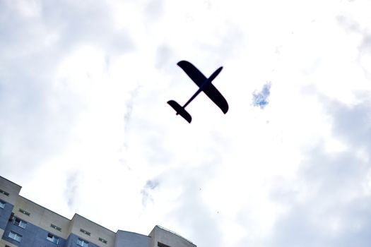 a child plays with a model airplane