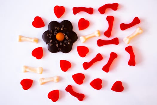 confectionery - marmalade in the form of a heart and cookies in the form of a flower