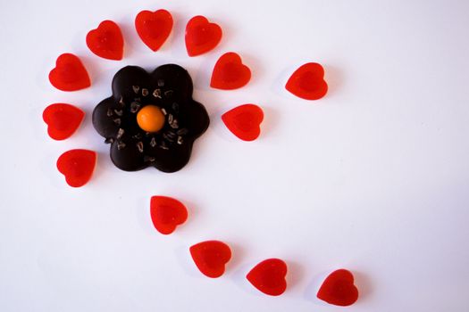 confectionery - marmalade in the form of a heart and cookies in the form of a flower