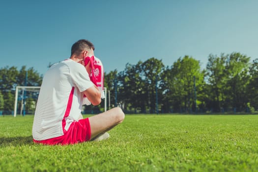 Crying Polish Football Fan After Lost Match. European Soccer Mundial Theme. Polish National Team Colors Wearing.