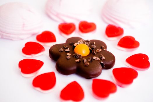 confectionery - marmalade in the form of a heart and cookies in the form of a flower