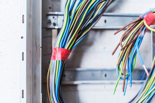 Electric Supply Box Mess. Bunch of Colorful Cables with No Tags. Electrical System Installation. Closeup Photo