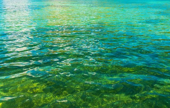 Crystal Clear Lake Water Closeup Photo. Nature Background Photo