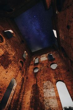 Stars over the old Lithgow blast furnace ruins before the clouds rolled in with jet speed from the west.  You can see the thick cloud through the windows and partially overhead but it creates an interesting scene. The Lithgow ruins with their unique arched and round windows  sit in Blast Furnace Park for all to come see and visit.