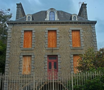 SOURDEVAL, FRANCE - April 6th 2019 - Big old stone house