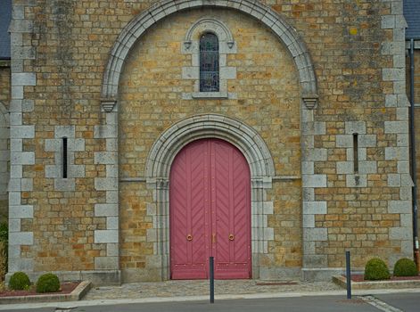 Main front entrance at big old stone catholic cathedral