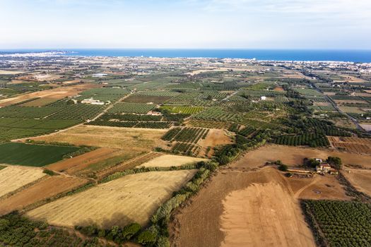 top view of crop farm fields near of Salou at the Mediterranean sea in Tarragona, background field agricultural industry aerial view