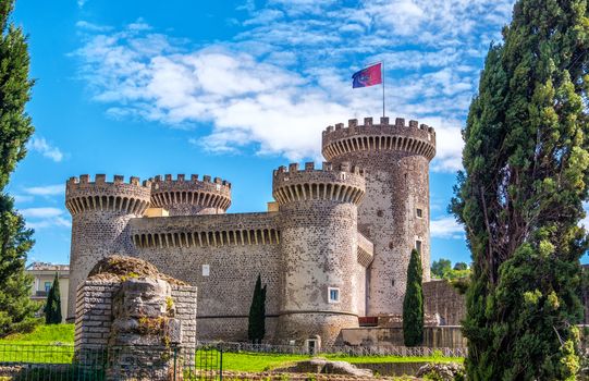 the Rocca Pia castle fortress in Tivoli - Italy during a sunny spring day - a landmark near Rome in Lazio .