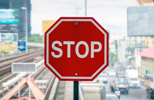 Red Octagonal Stop Sign on the Skytrain Platform