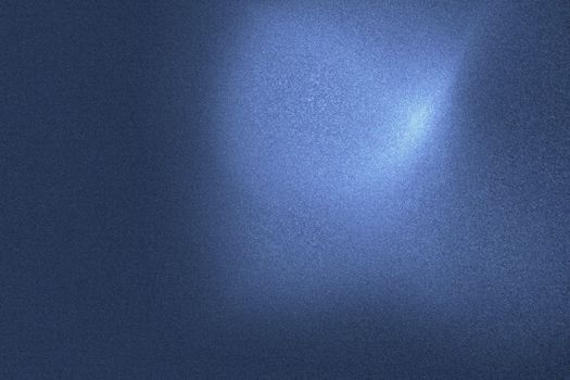Light shining on blue wave metallic wall in dark room, abstract texture background
