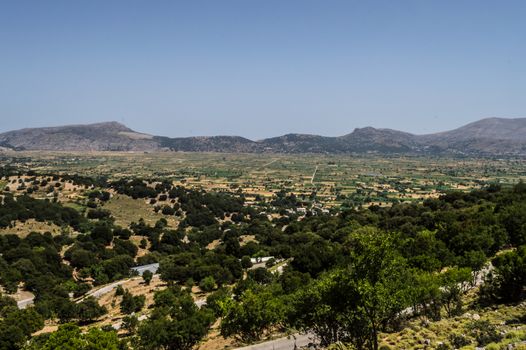 View of the fertile Lassithi Plateau in Crete. Panoramic view of the Lassithi Plateau in Crete, Greece