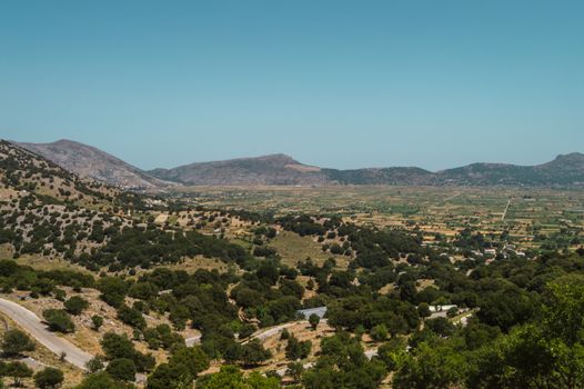 View of the fertile Lassithi Plateau in Crete. Panoramic view of the Lassithi Plateau in Crete, Greece