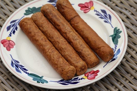 close up of frikandel, a traditional Dutch snack, a sort of minced meat hot dog