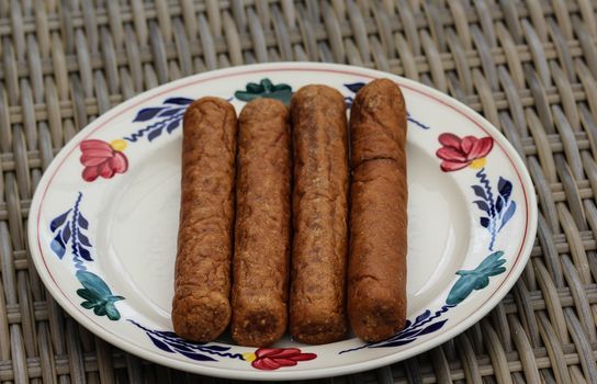 close up of frikandel, a traditional Dutch snack, a sort of minced meat hot dog