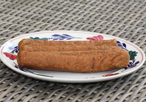 close up of frikandel, a traditional Dutch snack, a sort of minced meat hot dog