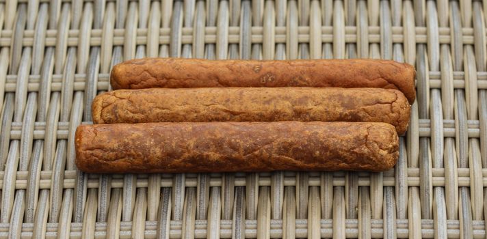 close up of frikandel, a traditional Dutch snack, a sort of minced meat hot dog