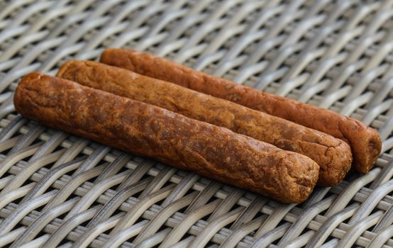 close up of frikandel, a traditional Dutch snack, a sort of minced meat hot dog