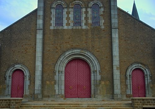 Main front entrance at big old stone catholic cathedral