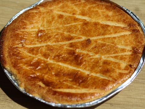 close up of Selfmade Dutch Butter Cake (Boterkoek) cookie, fresh baked from the oven. Displayed on wooden background
