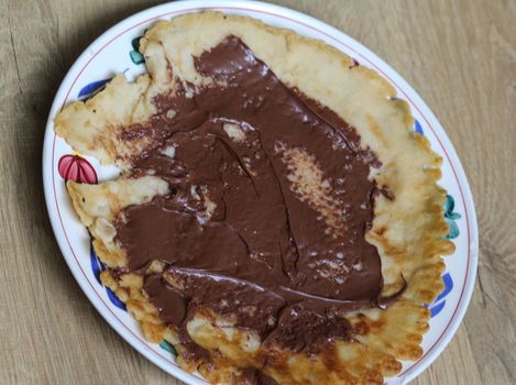 close up of pancake with chocolate pasta