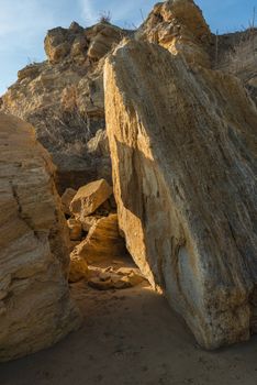 Big yellow stones on the shore