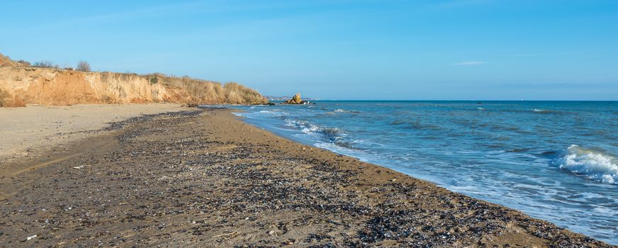 Sea coast dotted with mussel shells on the seashore near Odessa, Ukraine