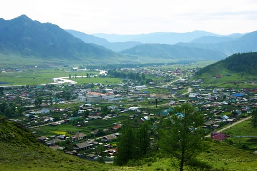 Mountain village in altai year daytime.Landscape of the village in mountain