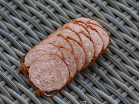close up of Dutch grilled sausage "grillworst" on wooden table background