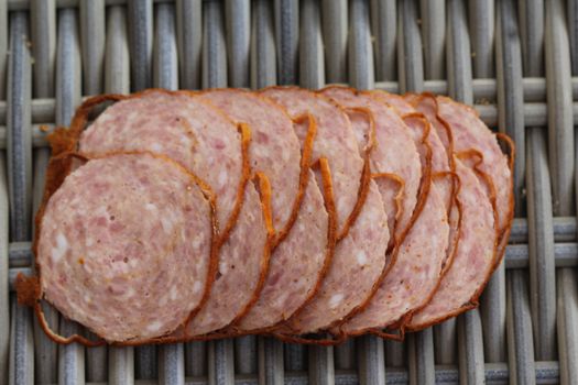 close up of Dutch grilled sausage "grillworst" on wooden table background