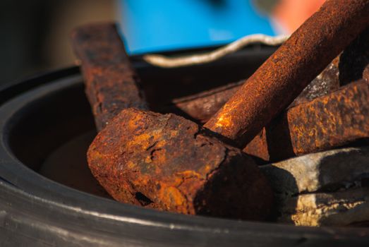 An old rusty hammer in the harbour