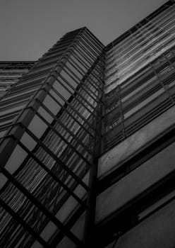 Looking up at black and white architecture