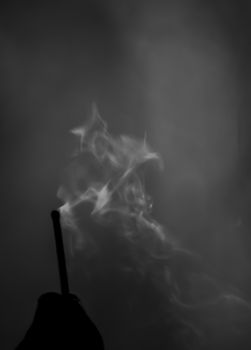 The smoke of an extinguished match